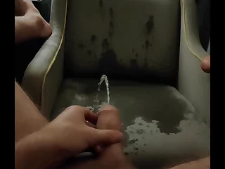 Hotel harlot indulges in her peeing fetish, spraying the upholstery. This naughty slut returns to her favorite motel, ready to mark her territory with a hot pee shower.