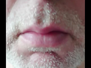 Amateur chubby bear with a beard teases his cock in the bathroom, licking and sucking it, all captured up close. Dirty talk adds to the raw, intimate experience.