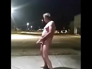 In a Colorado parking lot, an exhibitionist indulges in public masturbation. His solo act is a sight for other pervs, with his car's interior serving as a perfect stage for his self-pleasure show.