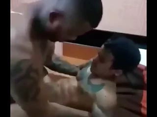 Tattooed stud packs a massive rod and loves teasing his midget mate with it. Their playful banter turns into a wild, kinky romp, with the little guy getting a taste of the big pie.