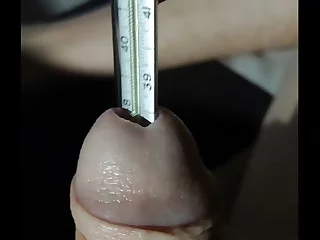A guy's dick gets a thermo treatment. He's not just fucking his girl, he's measuring the temperature of her wet pussy. The thermometer slides in, and he moans with pleasure as he feels the heat.