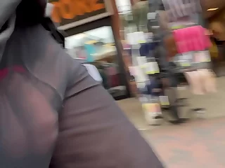 Sheer pants, transparent intentions. Public exhibitionist teases with her bare ass, revving up the action. Unzipping, she flaunts her cock, inviting voyeuristic eyes to feast on her nudist delight.
